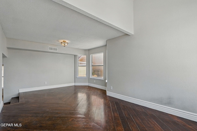 1718 Dean Jones Dr, El Paso, TX 79936 - empty room featuring baseboards, hardwood / wood-style flooring, and a textured ceiling