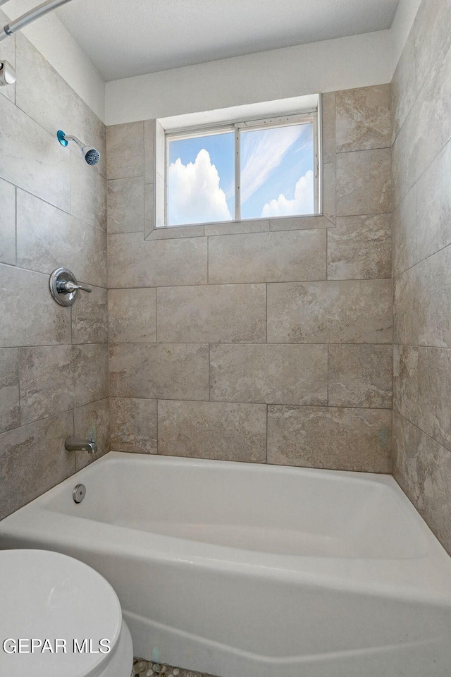 1718 Dean Jones Dr, El Paso, TX 79936 - full bathroom featuring toilet and  shower combination