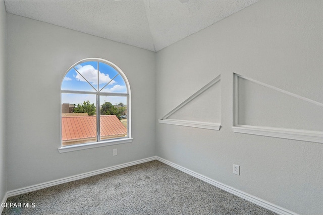 1718 Dean Jones Dr, El Paso, TX 79936 - carpeted empty room with baseboards and a textured ceiling