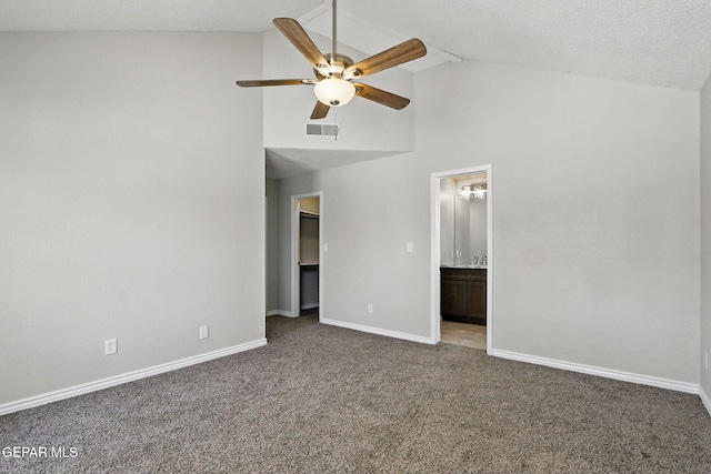 1718 Dean Jones Dr, El Paso, TX 79936 - unfurnished bedroom featuring carpet flooring, baseboards, high vaulted ceiling, connected bathroom, and ceiling fan