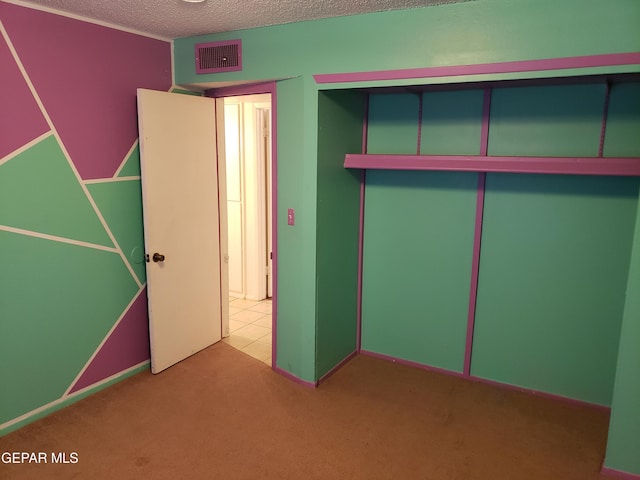 10173 Lakeview Dr, El Paso, TX 79924 - unfurnished bedroom featuring carpet flooring, a textured ceiling, a closet, and baseboards