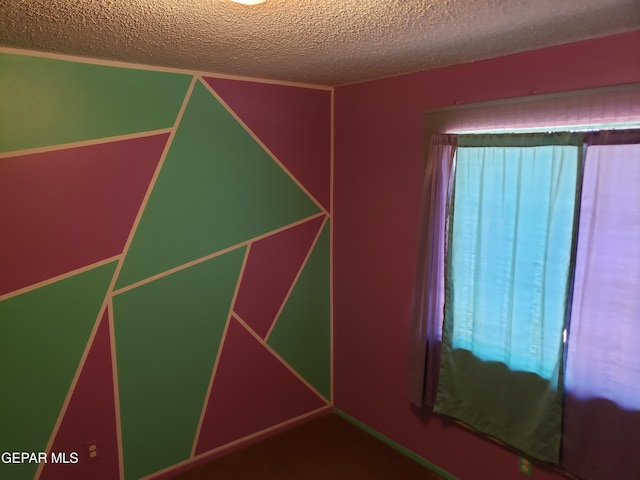 10173 Lakeview Dr, El Paso, TX 79924 - unfurnished room featuring a textured ceiling