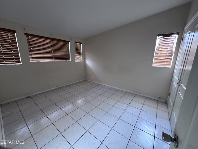 5403 Raymond Telles Rd, El Paso, TX 79924 - empty room with plenty of natural light, light tile patterned flooring, and baseboards