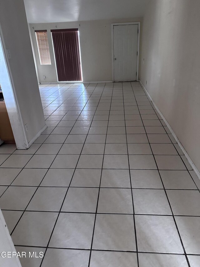 5403 Raymond Telles Rd, El Paso, TX 79924 - spare room featuring light tile patterned floors and baseboards