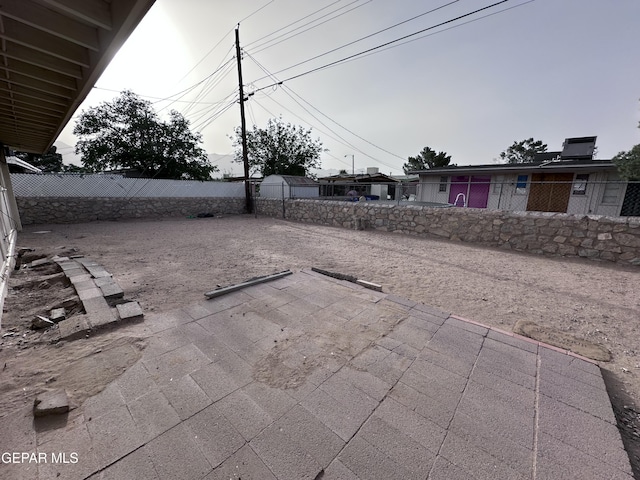 5403 Raymond Telles Rd, El Paso, TX 79924 - fenced backyard with a patio