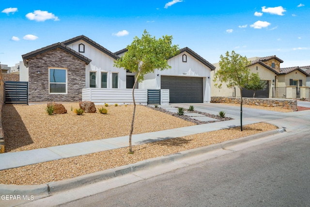 7467 Cimarron Gap Dr, El Paso, TX 79911 - ranch-style home featuring board and batten siding, a garage, driveway, and stone siding