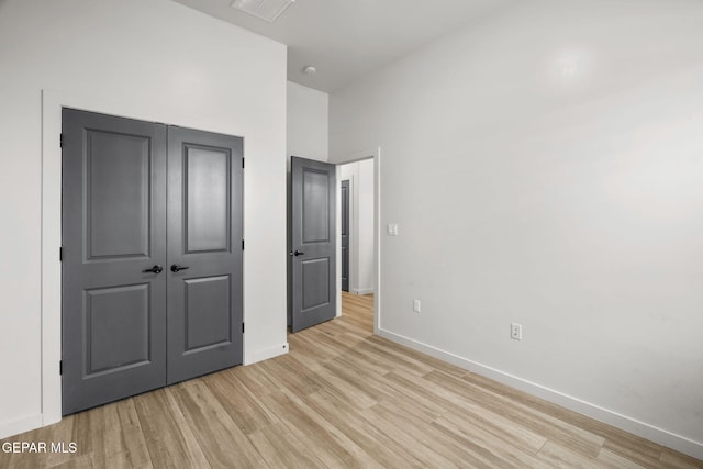 7467 Cimarron Gap Dr, El Paso, TX 79911 - unfurnished bedroom with light wood-style floors, baseboards, and a closet