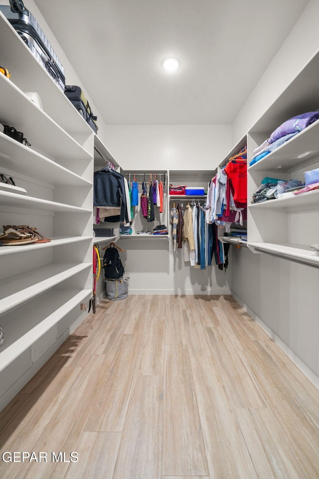 7467 Cimarron Gap Dr, El Paso, TX 79911 - walk in closet with wood finished floors