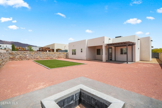7467 Cimarron Gap Dr, El Paso, TX 79911 - rear view of house featuring stucco siding, a patio, and a fenced backyard