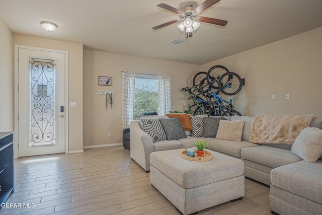 2221 Furtherpoint Pl, El Paso, TX 79911 - living room with ceiling fan, light wood-style flooring, and baseboards