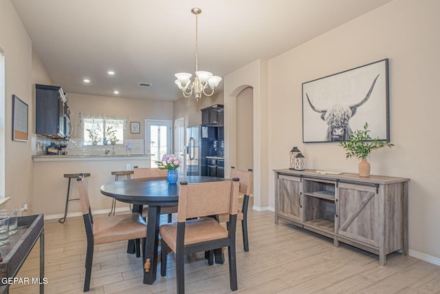 2221 Furtherpoint Pl, El Paso, TX 79911 - dining area with light wood finished floors, a chandelier, recessed lighting, and baseboards