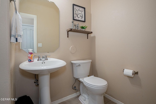 2221 Furtherpoint Pl, El Paso, TX 79911 - half bathroom with toilet and baseboards