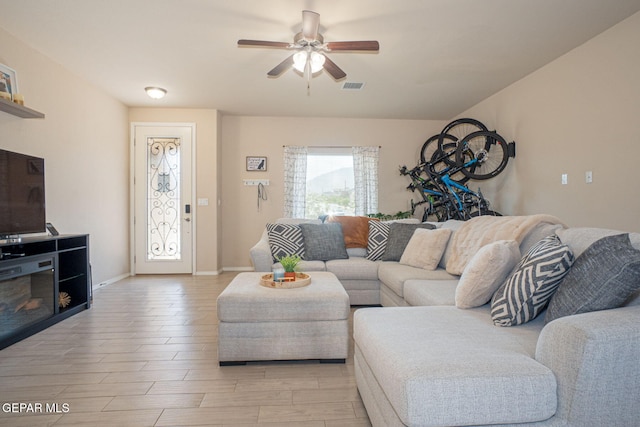2221 Furtherpoint Pl, El Paso, TX 79911 - living room featuring ceiling fan, light wood finished floors, and baseboards