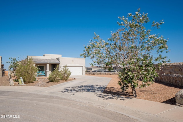 2221 Furtherpoint Pl, El Paso, TX 79911 - view of front facade featuring driveway, a garage, stucco siding, and a tiled roof