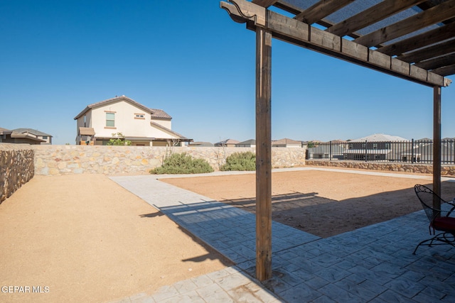 2221 Furtherpoint Pl, El Paso, TX 79911 - fenced backyard with a patio area and a pergola