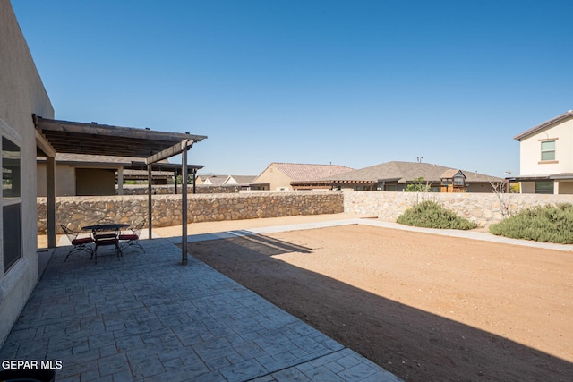 2221 Furtherpoint Pl, El Paso, TX 79911 - fenced backyard with a patio