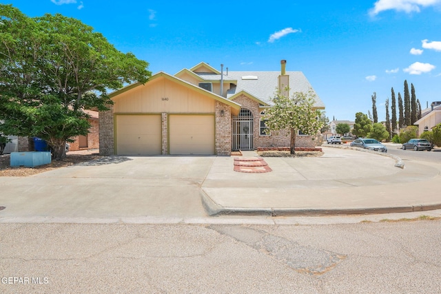 1640 Dennis Babjack Dr, El Paso, TX 79936 - view of front of property featuring brick siding, an attached garage, and concrete driveway