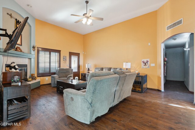 10819 Loma De Amor Ln, El Paso, TX 79934 - living area with high vaulted ceiling, arched walkways, a ceiling fan, wood finished floors, and baseboards
