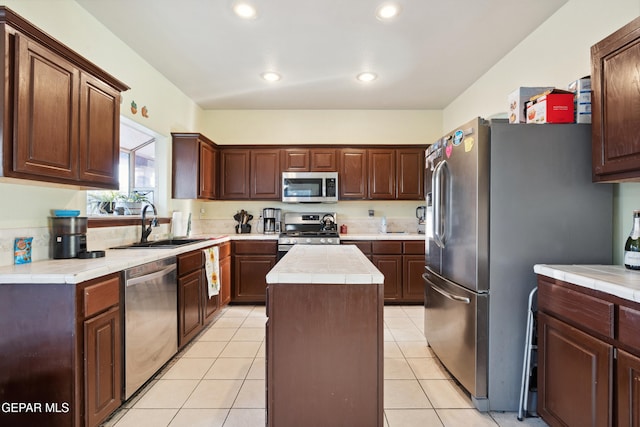 10819 Loma De Amor Ln, El Paso, TX 79934 - kitchen featuring stainless steel appliances, a sink, tile countertops, a kitchen island, and recessed lighting