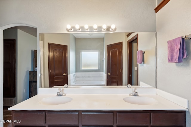 10819 Loma De Amor Ln, El Paso, TX 79934 - bathroom with double vanity and a garden tub