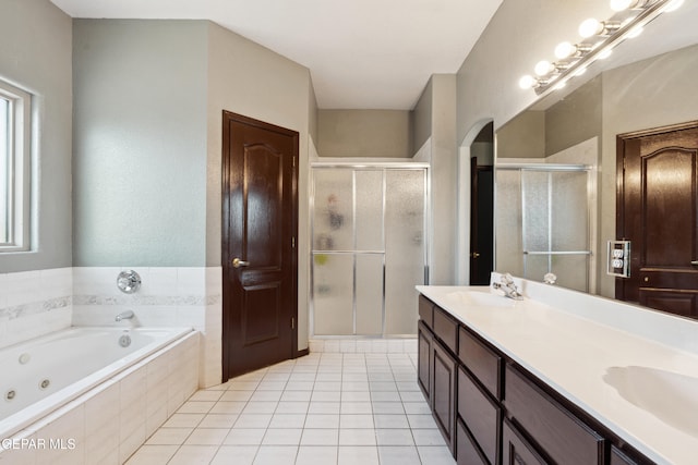 10819 Loma De Amor Ln, El Paso, TX 79934 - full bathroom with a shower stall, a whirlpool tub, double vanity, and tile patterned flooring