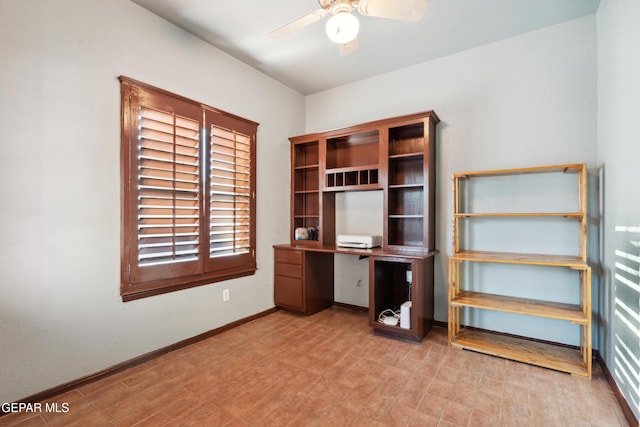 10819 Loma De Amor Ln, El Paso, TX 79934 - unfurnished office featuring a ceiling fan, plenty of natural light, baseboards, and light flooring