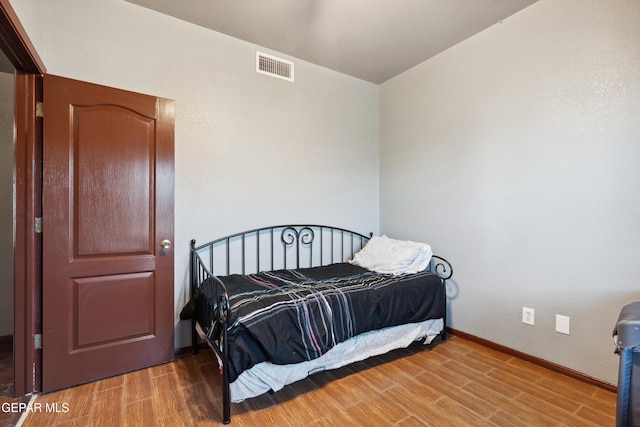10819 Loma De Amor Ln, El Paso, TX 79934 - bedroom with wood finished floors and baseboards