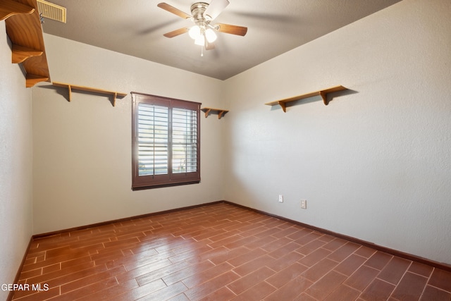 10819 Loma De Amor Ln, El Paso, TX 79934 - empty room featuring a ceiling fan, wood finished floors, and baseboards