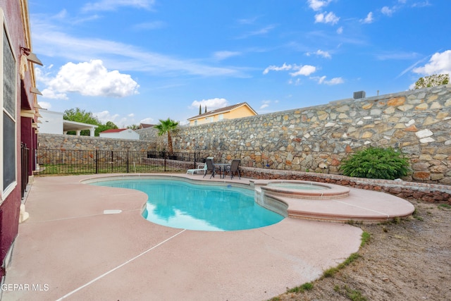 10819 Loma De Amor Ln, El Paso, TX 79934 - view of swimming pool featuring a patio, a fenced backyard, and a pool with connected hot tub