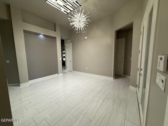 14529 Tierra Spring Ave, El Paso, TX 79938 - spare room with a chandelier and baseboards
