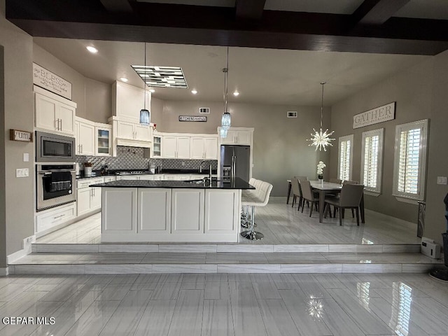 14529 Tierra Spring Ave, El Paso, TX 79938 - kitchen featuring stainless steel appliances, dark countertops, a sink, white cabinets, and recessed lighting