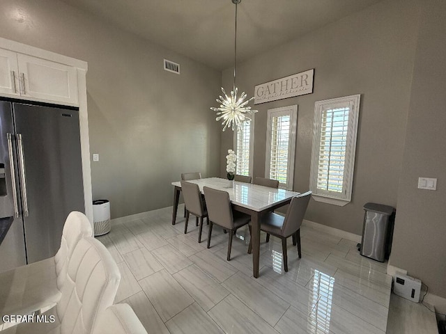 14529 Tierra Spring Ave, El Paso, TX 79938 - dining space with a chandelier and baseboards