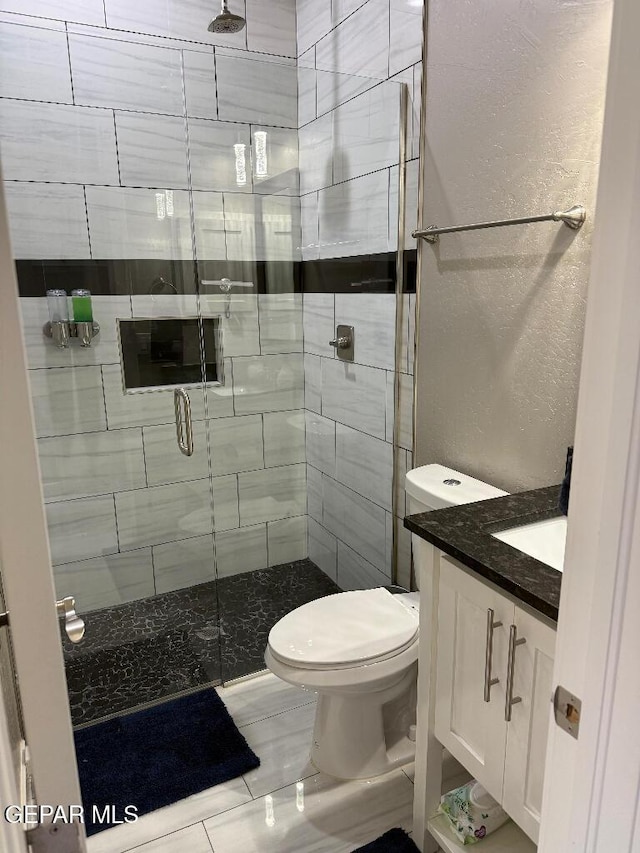 14529 Tierra Spring Ave, El Paso, TX 79938 - full bath featuring a shower stall, vanity, toilet, and a textured wall