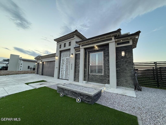14529 Tierra Spring Ave, El Paso, TX 79938 - view of front facade featuring concrete driveway, a garage, and stucco siding