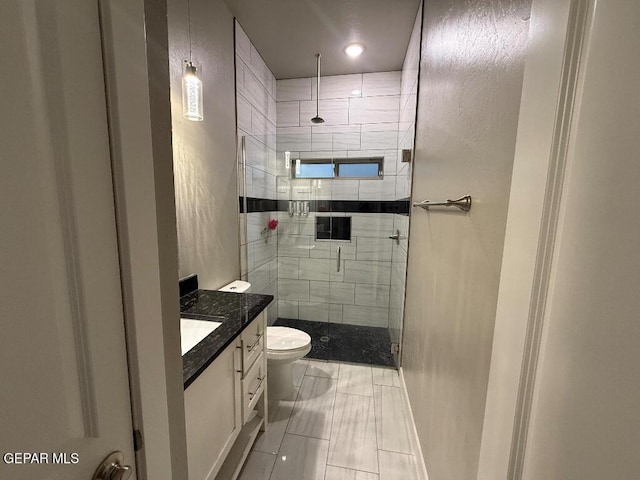 14529 Tierra Spring Ave, El Paso, TX 79938 - full bathroom featuring a stall shower, vanity, and toilet