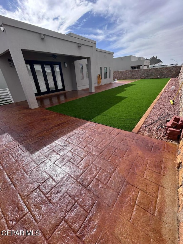 14529 Tierra Spring Ave, El Paso, TX 79938 - rear view of house with a patio area, a yard, stucco siding, and french doors