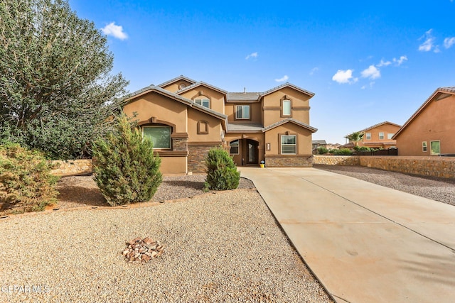 5505 Valley Cedar Dr, El Paso, TX 79932 - view of front of home with stucco siding, stone siding, and driveway