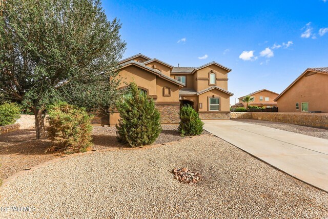 5505 Valley Cedar Dr, El Paso, TX 79932 - view of front facade featuring concrete driveway, stucco siding, and a tiled roof