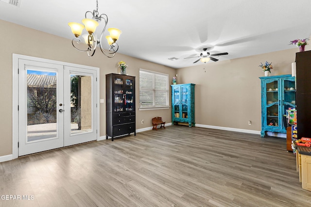 5505 Valley Cedar Dr, El Paso, TX 79932 - unfurnished room with light wood-style floors, french doors, ceiling fan, and a chandelier