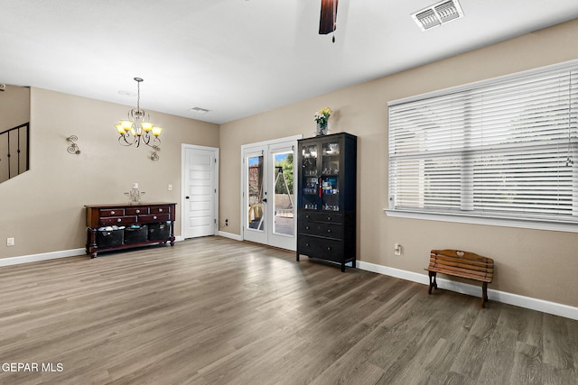 5505 Valley Cedar Dr, El Paso, TX 79932 - living room with wood finished floors, baseboards, ceiling fan, and a chandelier
