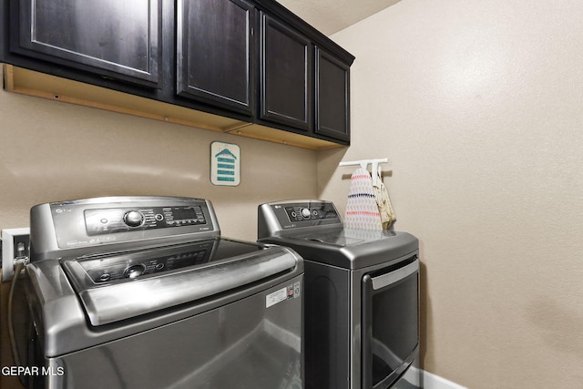 5505 Valley Cedar Dr, El Paso, TX 79932 - washroom with cabinet space and washer and clothes dryer