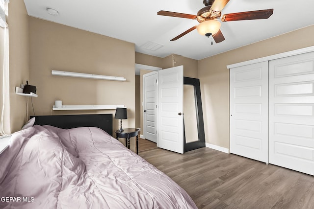 5505 Valley Cedar Dr, El Paso, TX 79932 - bedroom with wood finished floors, a closet, baseboards, and a ceiling fan