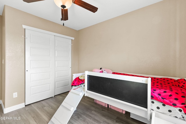 5505 Valley Cedar Dr, El Paso, TX 79932 - bedroom with wood finished floors, baseboards, a closet, and a ceiling fan
