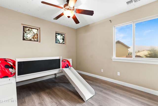 5505 Valley Cedar Dr, El Paso, TX 79932 - bedroom featuring wood finished floors, baseboards, and multiple windows