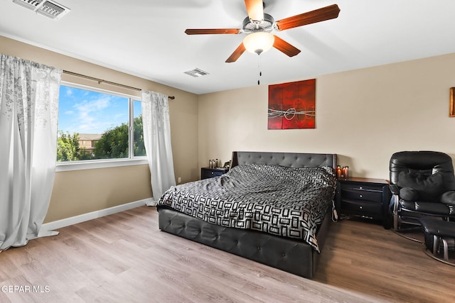 5505 Valley Cedar Dr, El Paso, TX 79932 - bedroom with wood finished floors, baseboards, and a ceiling fan