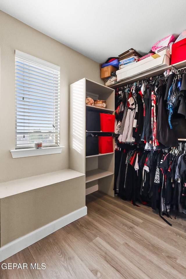 5505 Valley Cedar Dr, El Paso, TX 79932 - walk in closet with wood finished floors