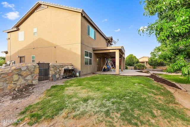 5505 Valley Cedar Dr, El Paso, TX 79932 - back of property featuring a patio, a lawn, and stucco siding