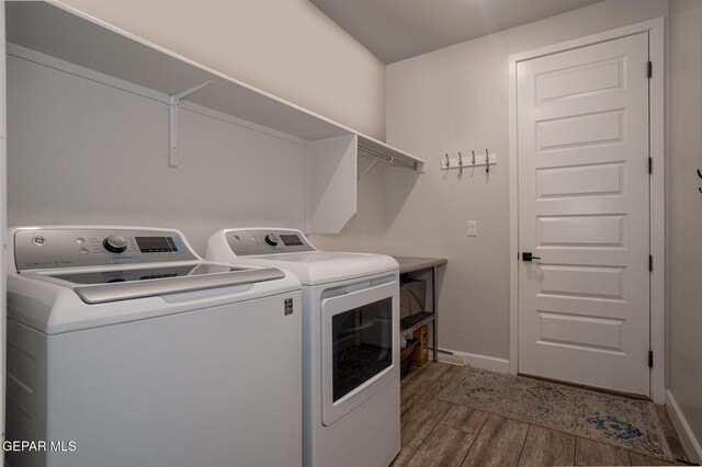 13436 Emerald Crystal Dr, El Paso, TX 79928 - laundry room featuring washing machine and dryer, dark wood finished floors, and baseboards