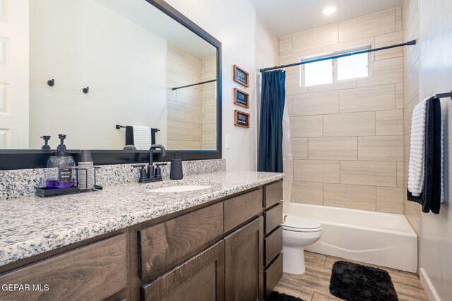 13436 Emerald Crystal Dr, El Paso, TX 79928 - full bath featuring vanity, toilet, shower / tub combo, and wood finished floors