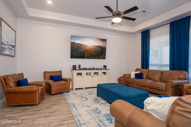 13436 Emerald Crystal Dr, El Paso, TX 79928 - living area featuring a tray ceiling, light wood finished floors, ceiling fan, recessed lighting, and baseboards